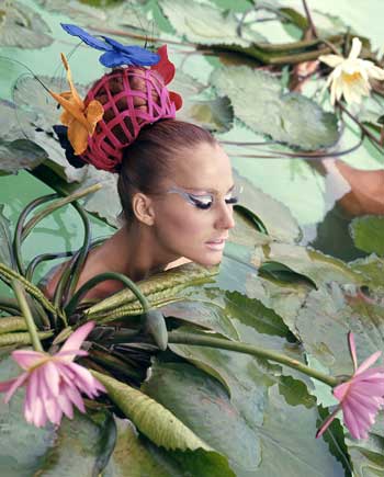 Norman Parkinson. Model in lily pond, Tahiti, US Vogue, 1965